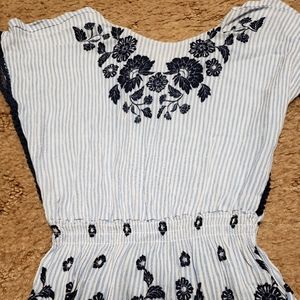 Beautiful white and light blue striped blouse with navy embroidery details.